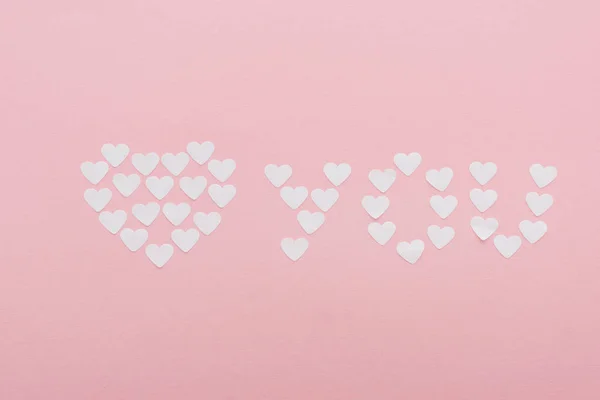 Top view of 'love you' made of paper hearts isolated on pink, st valentines day concept — Stock Image Top View Love You Made Paper Hearts Isolated Pink Valentines Stock Picture