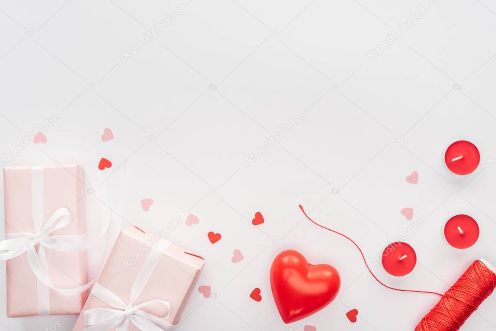 top view of gift boxes and valentines decorations isolated on white