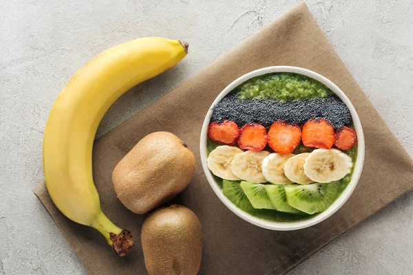 Top View Delicious Smoothie Bowl Fresh Fruits Ingredients Grey Background — Stock Photo, Image