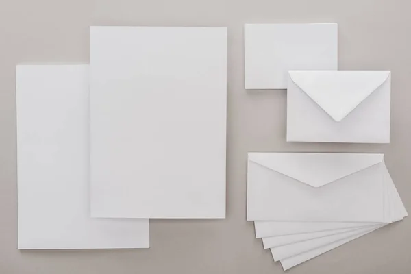 Top View White Empty Papers Envelopes Grey Background — Stock Photo, Image