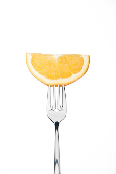half slice of fresh ripe juicy orange on fork isolated on white