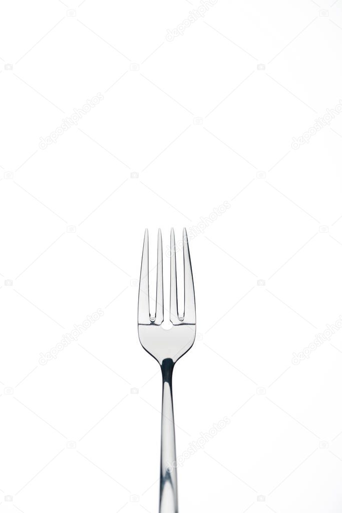 four-prong metal shiny fork isolated on white