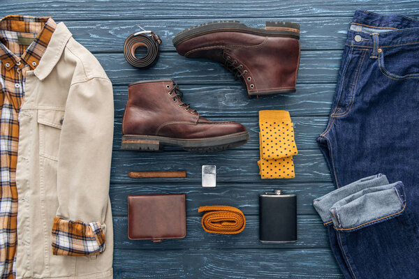 Flat lay with male clothes, shoes, cigar and accessories on wooden background