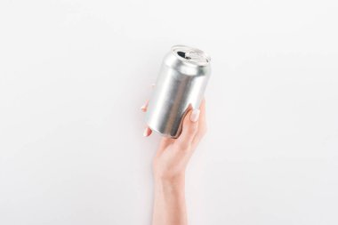 Partial view of woman holding empty can on grey background clipart