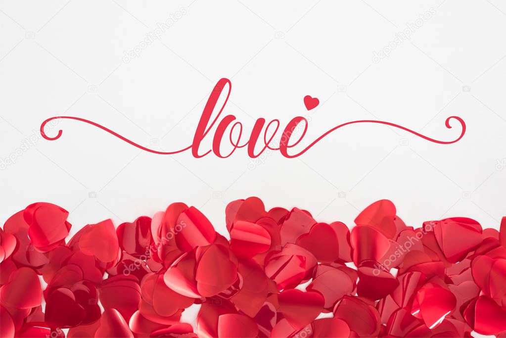 close-up view of beautiful red heart shaped petals on grey background with 