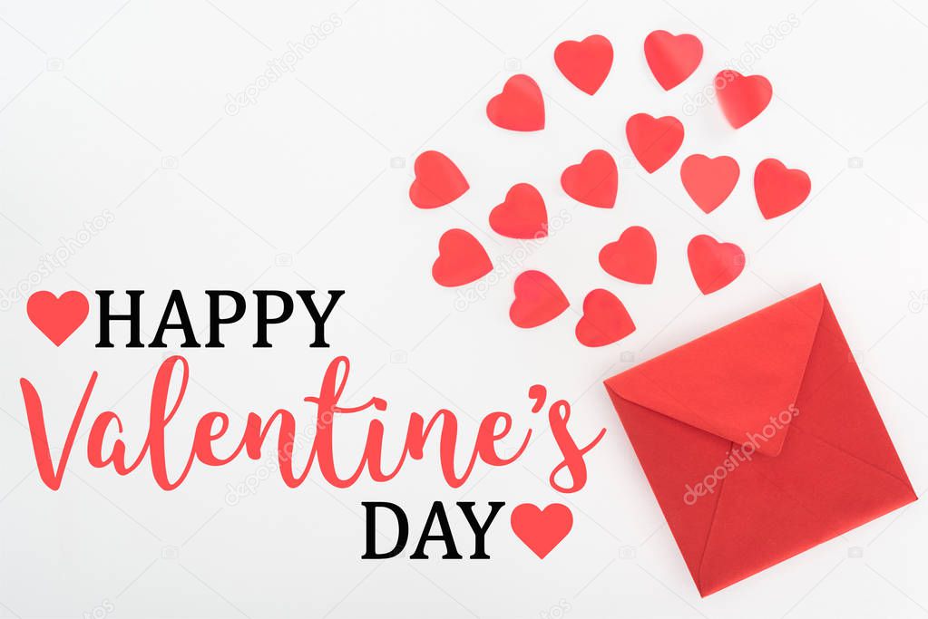 elevated view of heart symbols and red envelope isolated on white, happy valentines day