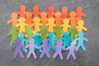 colorful paper cut figures of lgbt pride on grey background, lgbt concept clipart