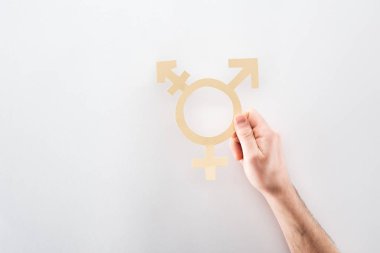 cropped view of male hand with paper cut gender sign on grey background, lgbt concept clipart
