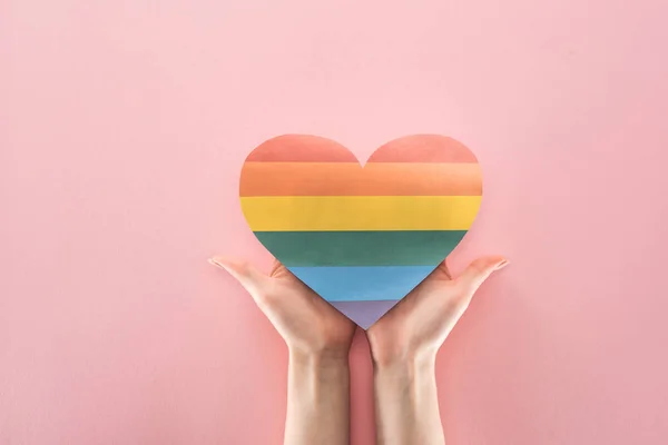 Partial View Female Hands Rainbow Colored Paper Heart Pink Background — Stock Photo, Image