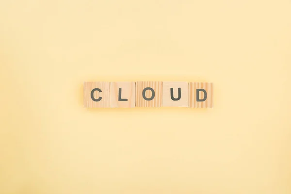 Top View Cloud Lettering Made Wooden Cubes Yellow Background — Stock Photo, Image