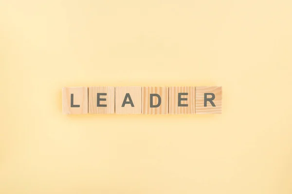 Top View Leader Lettering Made Wood Cubes Yellow Background — Stok Foto