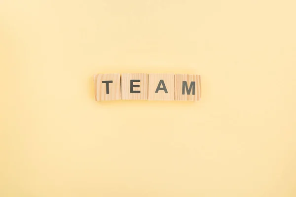 Top View Team Lettering Made Wood Cubes Yellow Background — Stok Foto