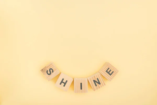 Top View Shine Lettering Made Wooden Blocks Yellow Background — Stock Photo, Image