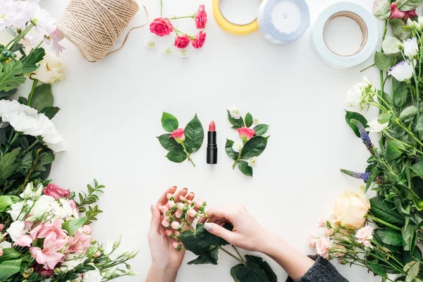 Cropped View Female Hands Holding Berries Boutonnieres Lipstick Surrounded Flowers — Stock Photo, Image