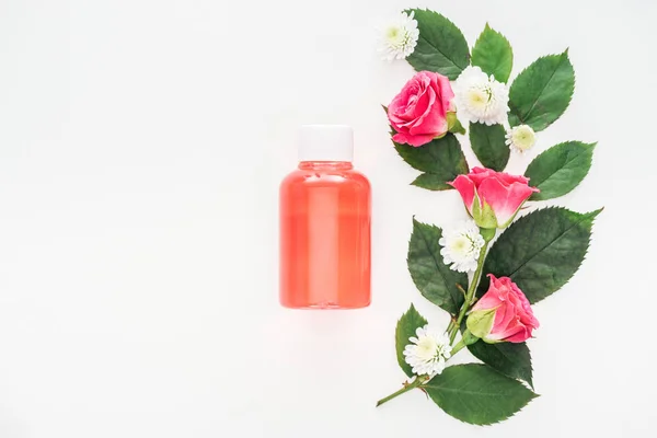 Top View Flowers Composition Bottle Orange Lotion Isolated White — Stock Photo, Image