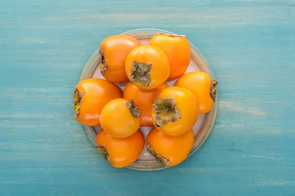 Top View Orange Ripe Persimmons White Plate — Stock Photo, Image