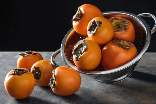 Orange Whole Persimmons Colander Stoned Table — Stock Photo, Image