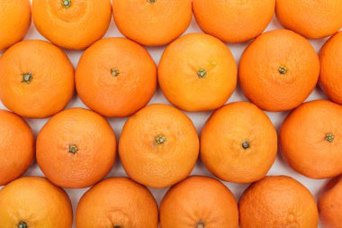 top view of whole ripe tangerines on white background clipart