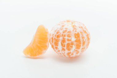 ripe juicy orange whole peeled tangerine with slice on white background clipart