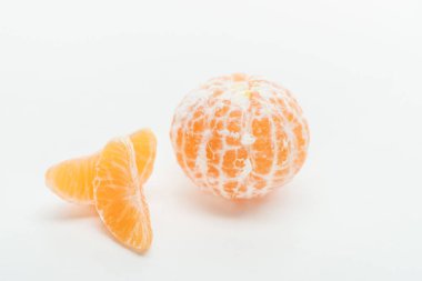 tangerine slices and ripe orange whole fruit on white background clipart