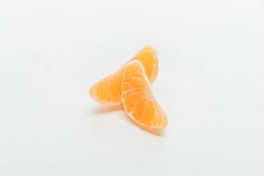 ripe bright orange tangerine slices on white background clipart