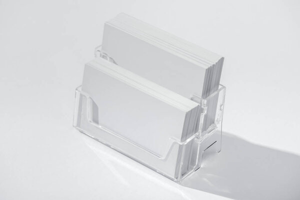 blank cards in card holder on white background with copy space