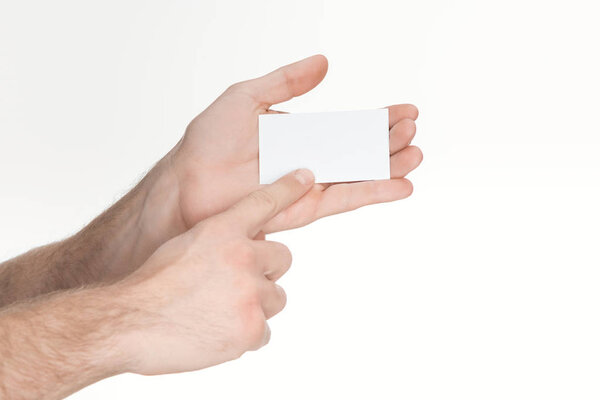 cropped view of man holding blank and empty card isolated on white