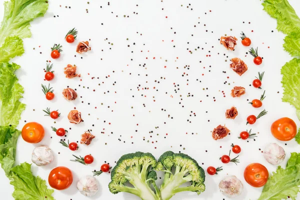 Top View Tomatoes Lettuce Leaves Prosciutto Broccoli Spices Garlic — Stock Photo, Image