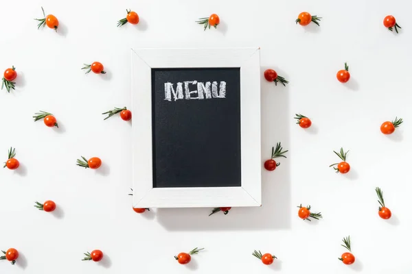 Top view of chalk board with menu lettering among cherry tomatoes and leaves — Stock Image Top View Chalk Board Menu Lettering Cherry Tomatoes Leaves Royalty Free Stock Photos