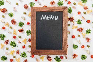 chalk board with menu lettering among olives, garlic cloves, prosciutto, greenery, cut cheese and cherry tomatoes clipart