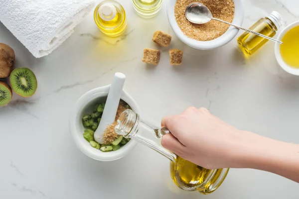 Partial View Woman Adding Oil Pounder Kiwi White Surface — Stock Photo, Image