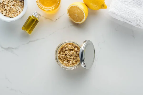 Top View Glass Container Mix Oat Flakes Honey White Surface — Stock Photo, Image