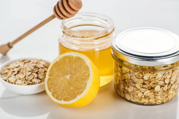 Selective Focus Glass Jars Honey Oat Flakes Lemon Honey Stick — Stock Photo, Image