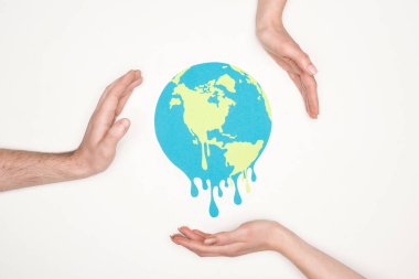 cropped view of male and female hands around paper cut melting globe on white background, global warming concept clipart