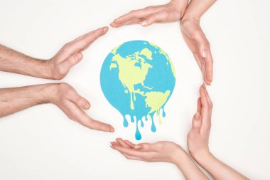 cropped view of women and men surrounding paper cut melting globe with hands on white background, global warming concept clipart
