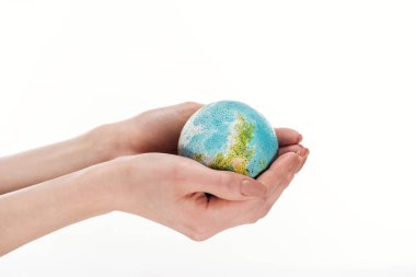 partial view of female hands with globe model isolated on white, global warming concept clipart