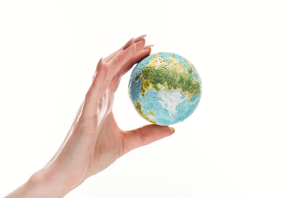 partial view of female hand with earth model isolated on white, global warming concept