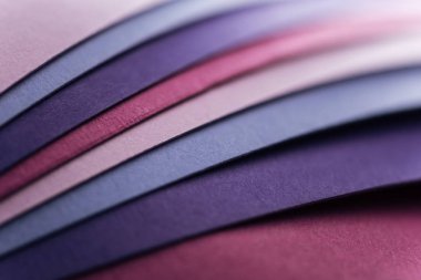 blank blue, pink, burgundy and purple sheets of paper with copy space 