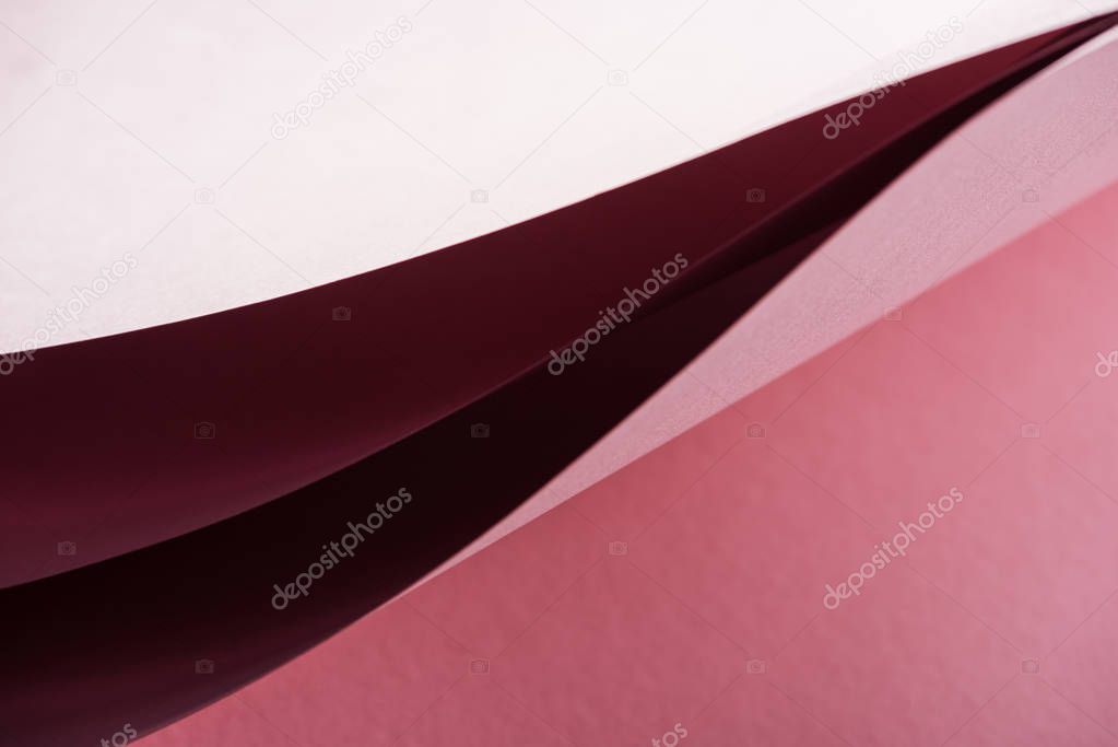 blank and colorful sheets of paper on pink background with copy space 