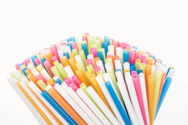 selective focus of colorful and bright plastic straws isolated on white with copy space  clipart