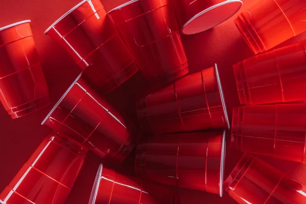 Top View Bright Colorful Plastic Cups Red Background — Stock Photo, Image