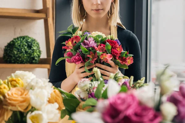 Cropped view of florist in apron holding bouquet in flower shop — Stock Image Cropped View Florist Apron Holding Bouquet Flower Shop Royalty Free Stock Images