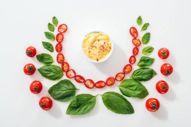flat lay with cut chili peppers, basil leaves, sauce and ripe cherry tomatoes clipart