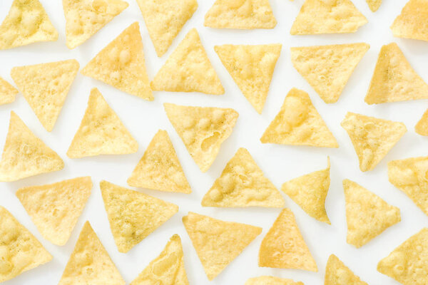 top view of tasty and delicious nachos on white background 