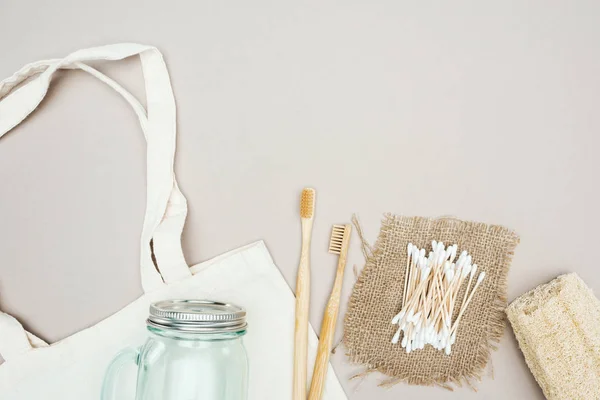 Wooden Toothbrushes Organic Loofah Cotton Swabs Sackcloth Glass Jar White — Stock Photo, Image