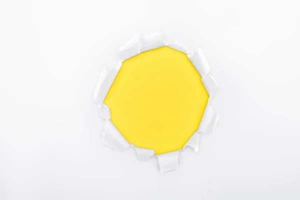 Torn Hole White Textured Paper Yellow Background — Stock Photo, Image