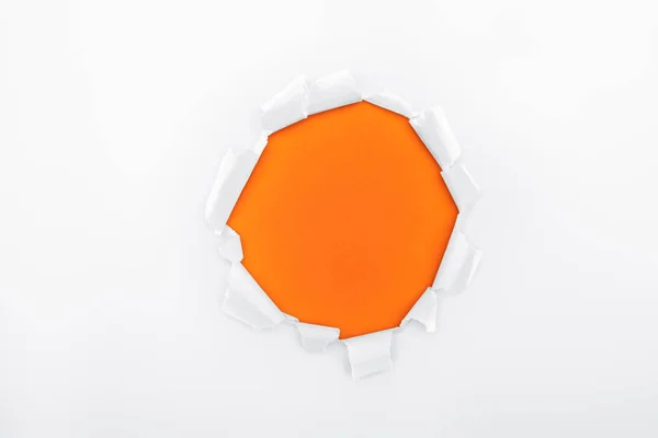 Torn Hole White Textured Paper Orange Background — Stock Photo, Image