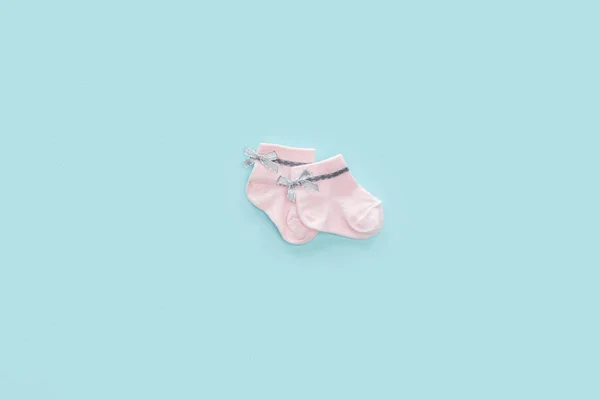 Top View Pink Socks Blue Pastel Background Copy Space — Stock Photo, Image