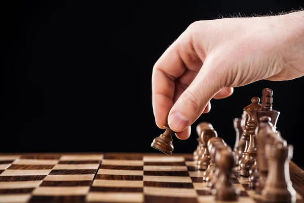 Partial View Man Doing Move Wooden Chessboard Isolated Black — Stock Photo, Image