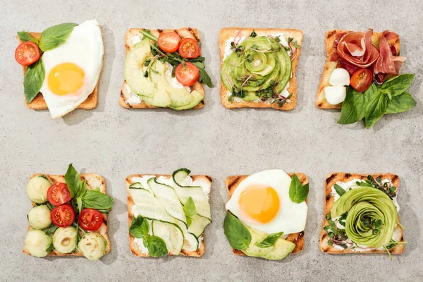 Top View Toasts Vegetables Fried Eggs Prosciutto Textured Surface — Stock Photo, Image